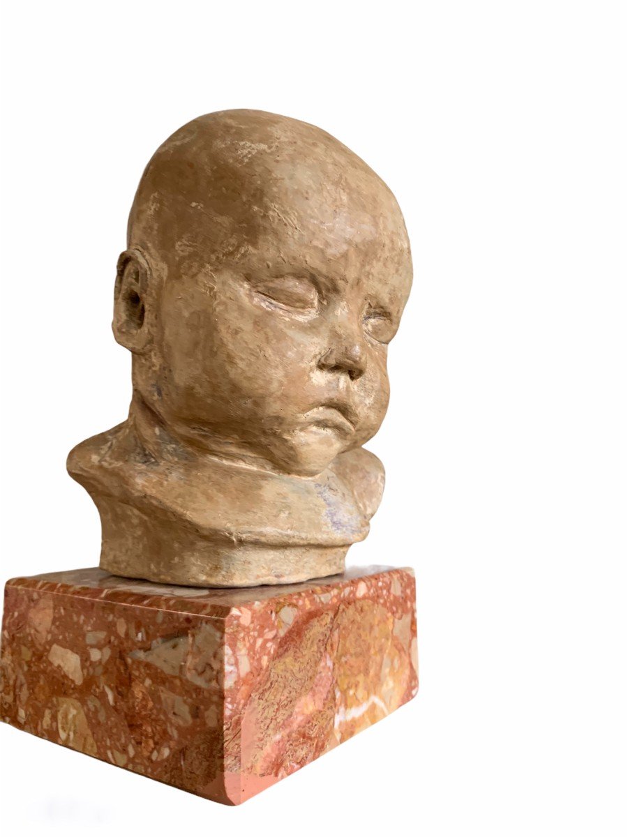 Terracotta Head Of A Sleeping Child. Terracotta. 20th Century French School.