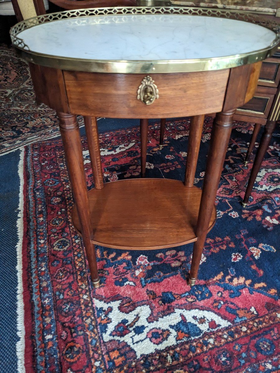 Small Louis XVI Period Oval Living Room Table In Blond Mahogany.