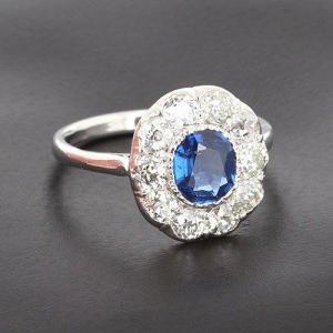Marguerite Ring In Platinum Presenting A Sapphire Of Approx 0.80ct Surrounded By Diamonds B10420