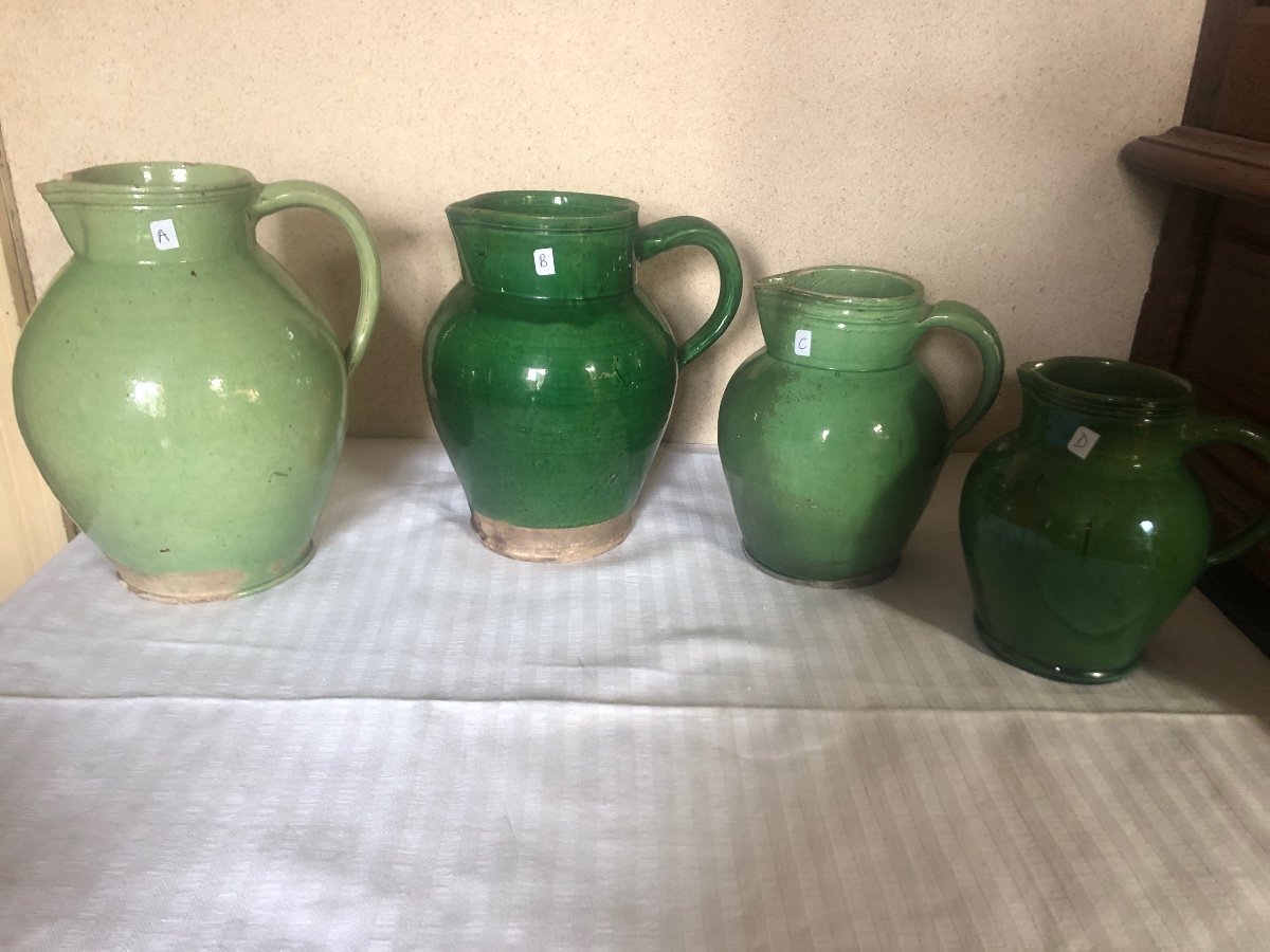 Pitchers, Milk Jugs (x4) In Green Glazed Earthenware. 19th And 20th Century. Sarthe Pottery 