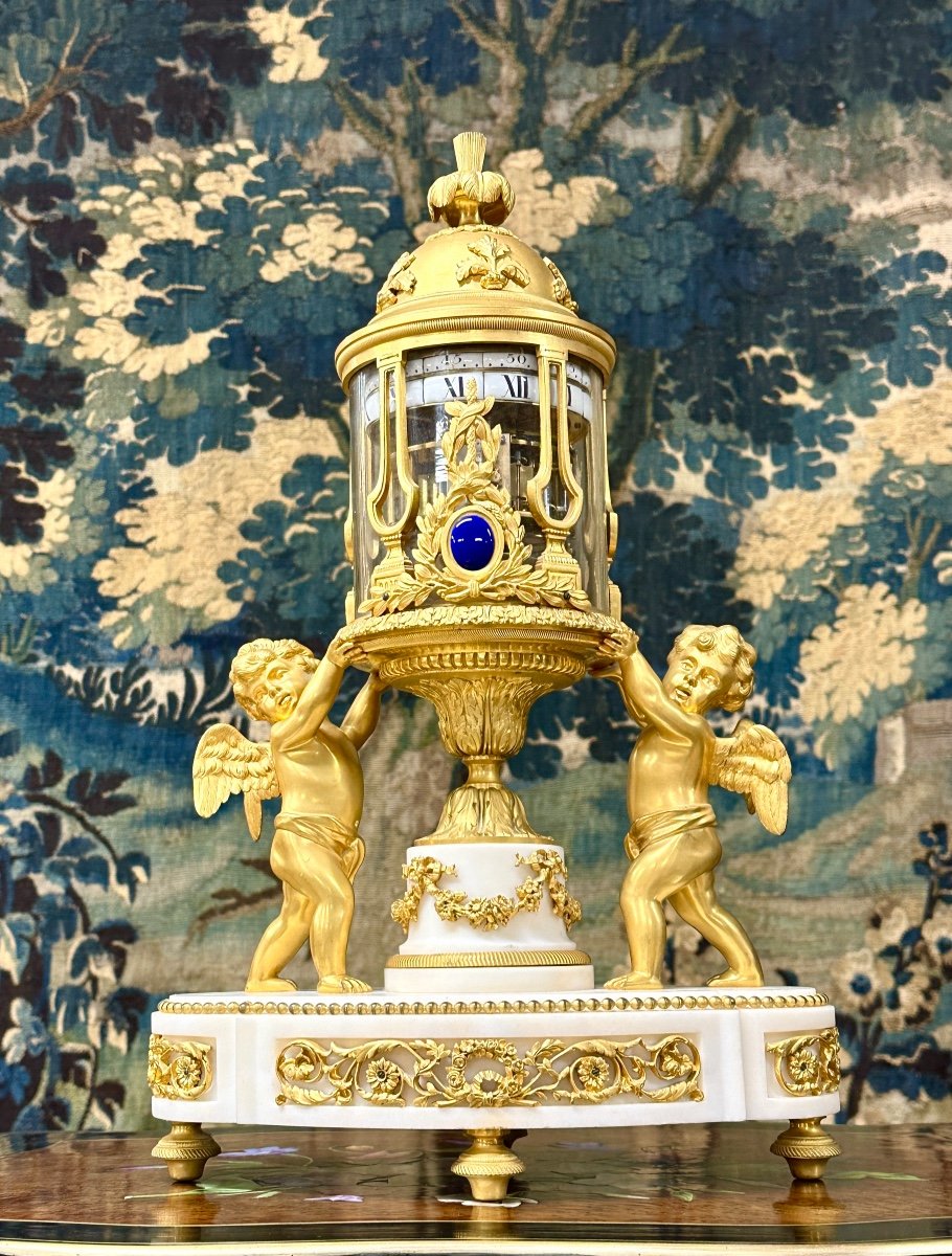 Rare Pendule en bronze doré à Cercles Tournants De Style Louis XVI. époque Napoléon III