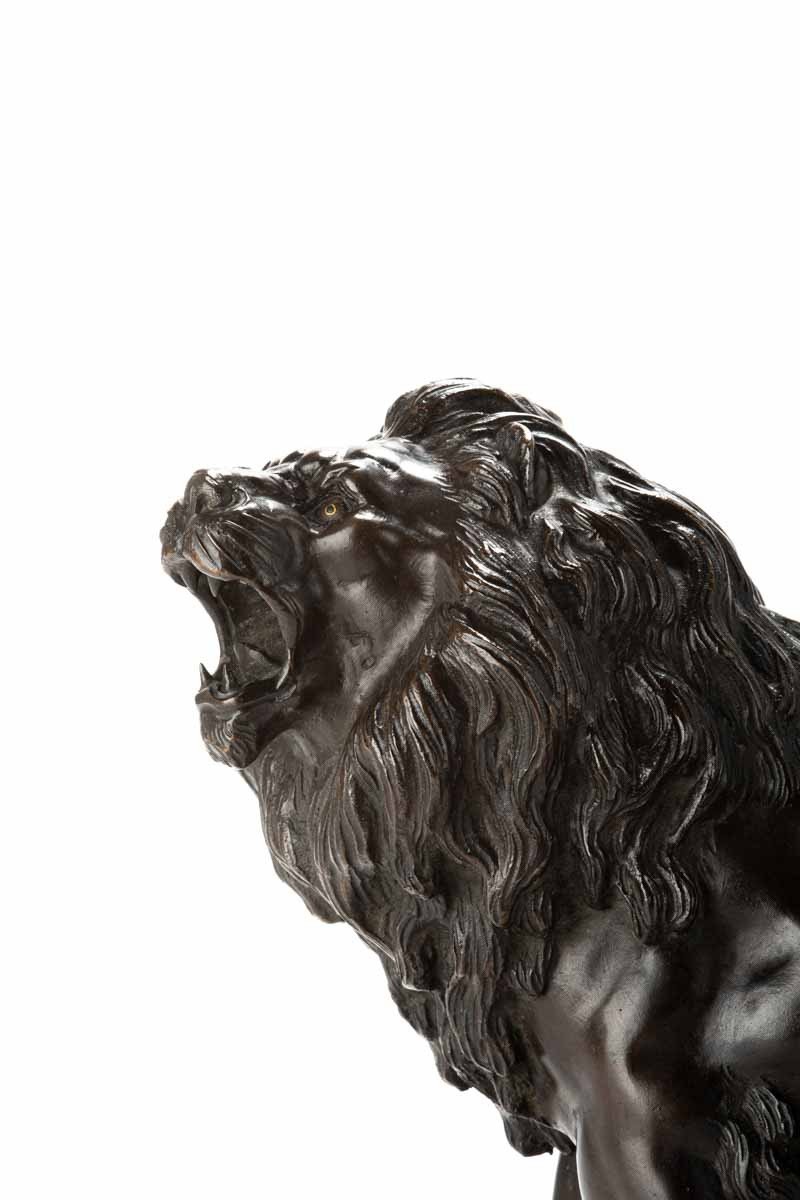 A Japanese Bronze Okimono Depicting A Roaring Lion