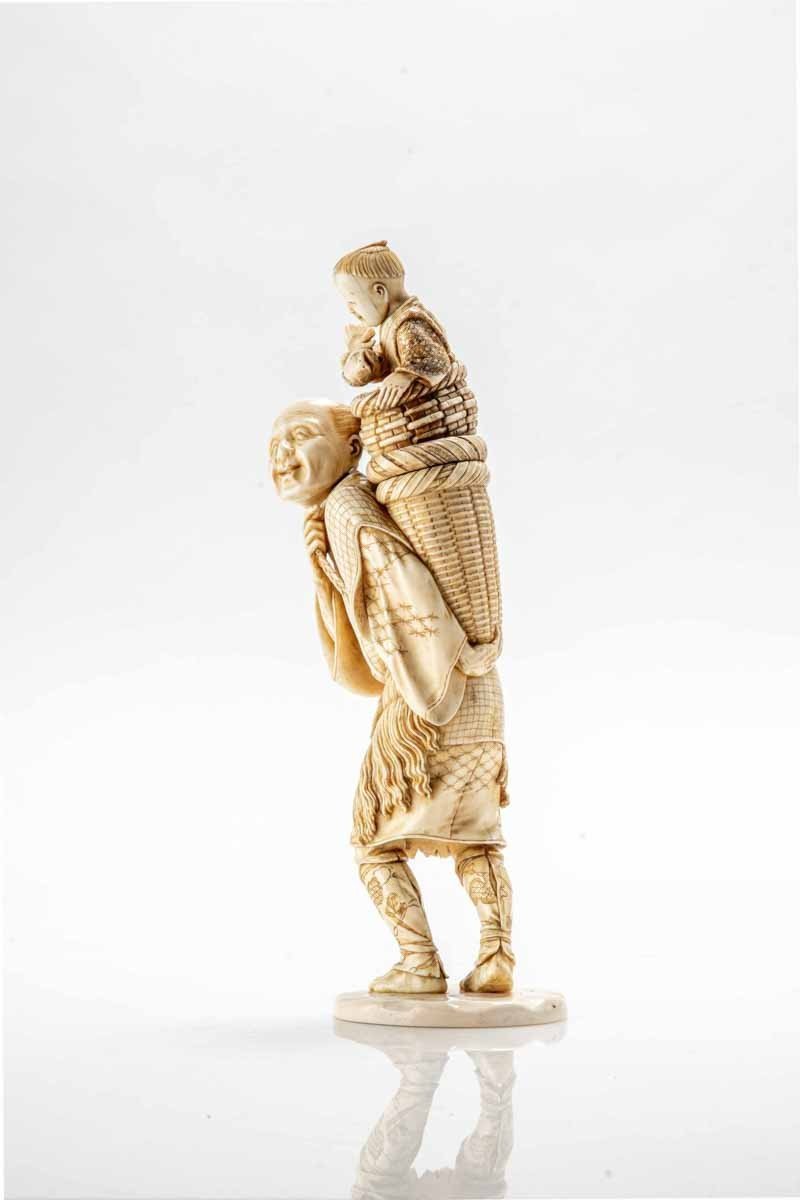 An Ivory Okimono Depicting A Fisherman With His Child-photo-3