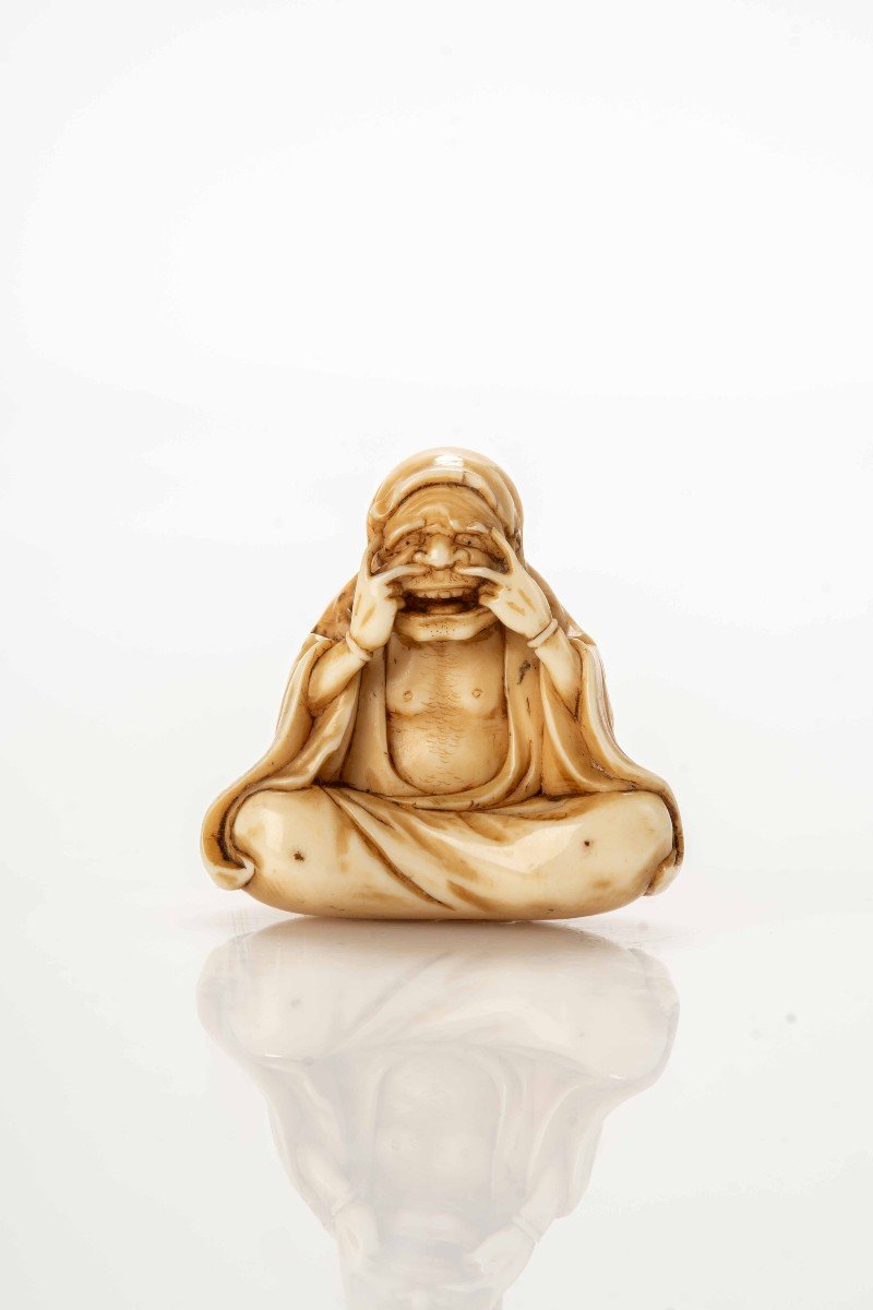 An Ivory Netsuke Depicting The Awakening Of Daruma