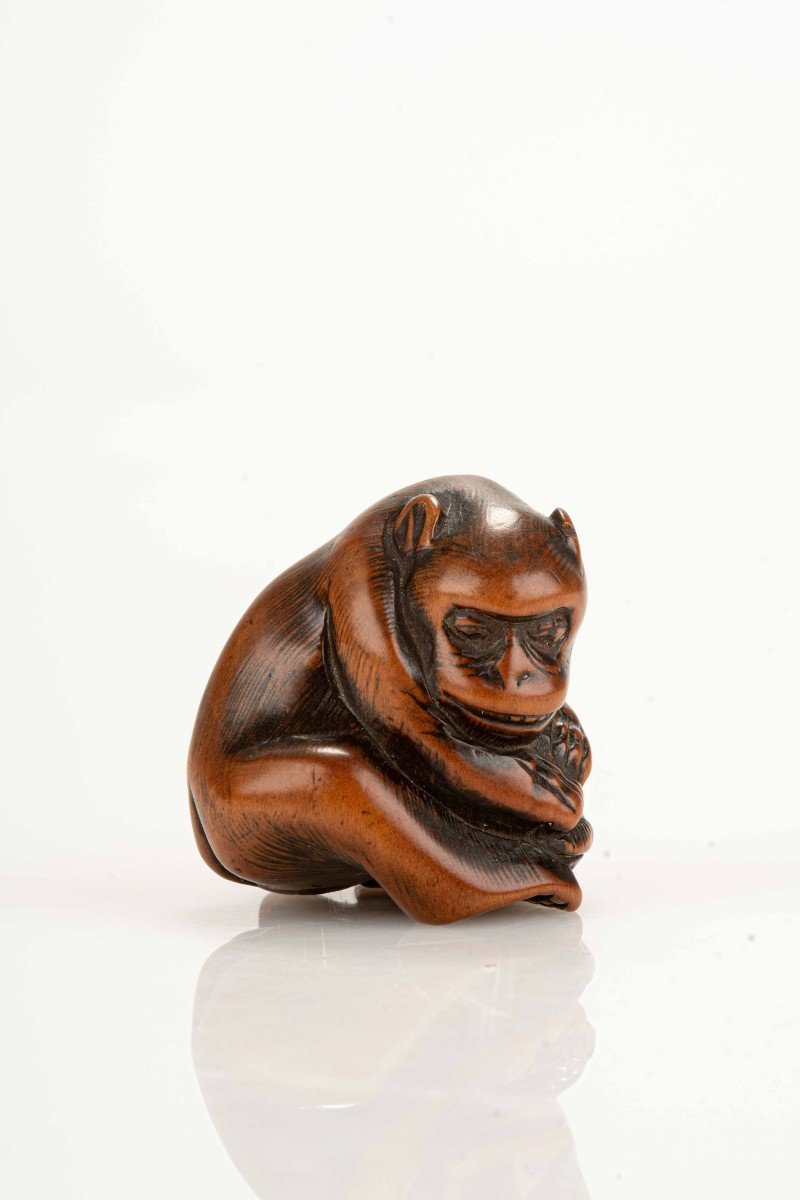 A Japanese Netsuke Depicting A Monkey With A Turtle