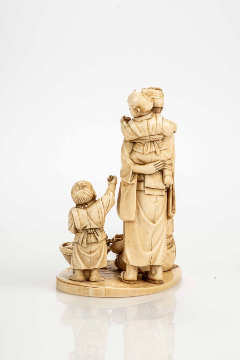 An Ivory Okimono Depicting A Seafood Vendor With His Family-photo-3