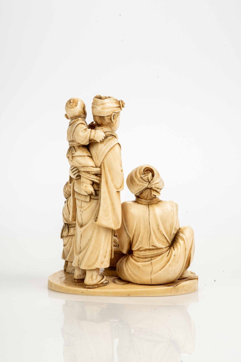 An Ivory Okimono Depicting A Seafood Vendor With His Family-photo-4