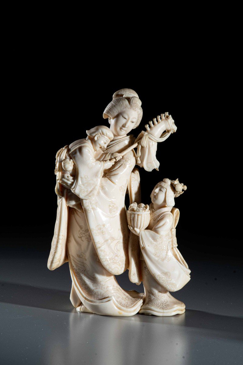 An Ivory Okimono Depicting A Family Scene, Signed Norikazu