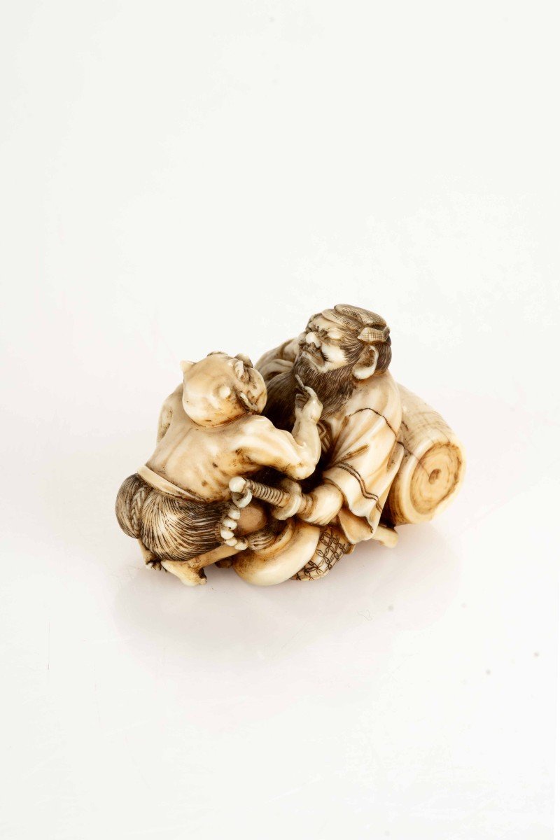 An Ivory Netsuke Depicting Shoki With An Oni