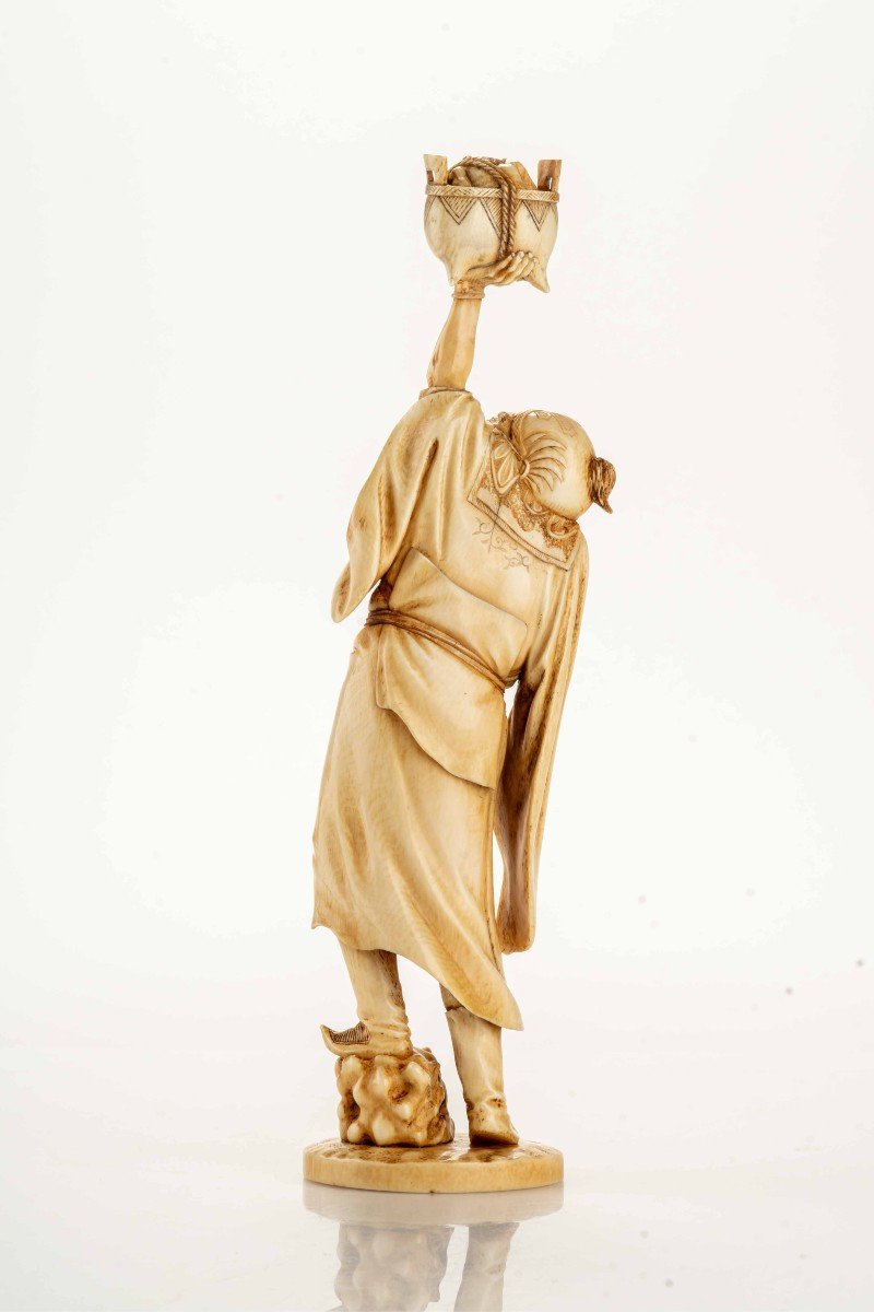 An Ivory Okimono Depicting A Standing Shoki Holding A Large Koro-photo-3