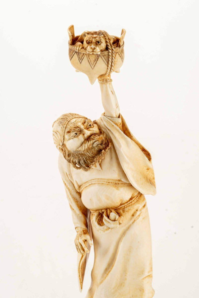 An Ivory Okimono Depicting A Standing Shoki Holding A Large Koro-photo-4