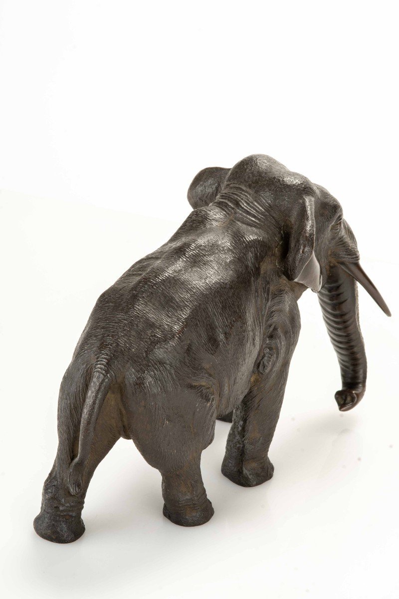 A Bronze Okimono Depicting A Walking Elephant-photo-1