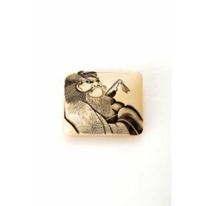 A Rectangular Netsuke Manju With Shoki