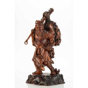 A Boxwood Okimono Depicting Shoki With Oni