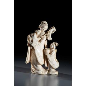 An Ivory Okimono Depicting A Family Scene, Signed Norikazu