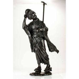 A Tokyo School Bronze Okimono Depicting A Walking Geisha