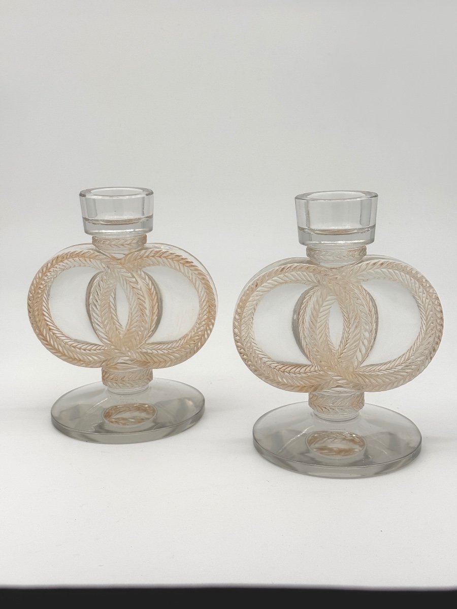 A Pair Of Malmaison Candlesticks By Lalique