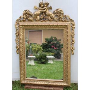 Carved And Golden Wood Mirror, From The Late 18th/early 19th Century Period.