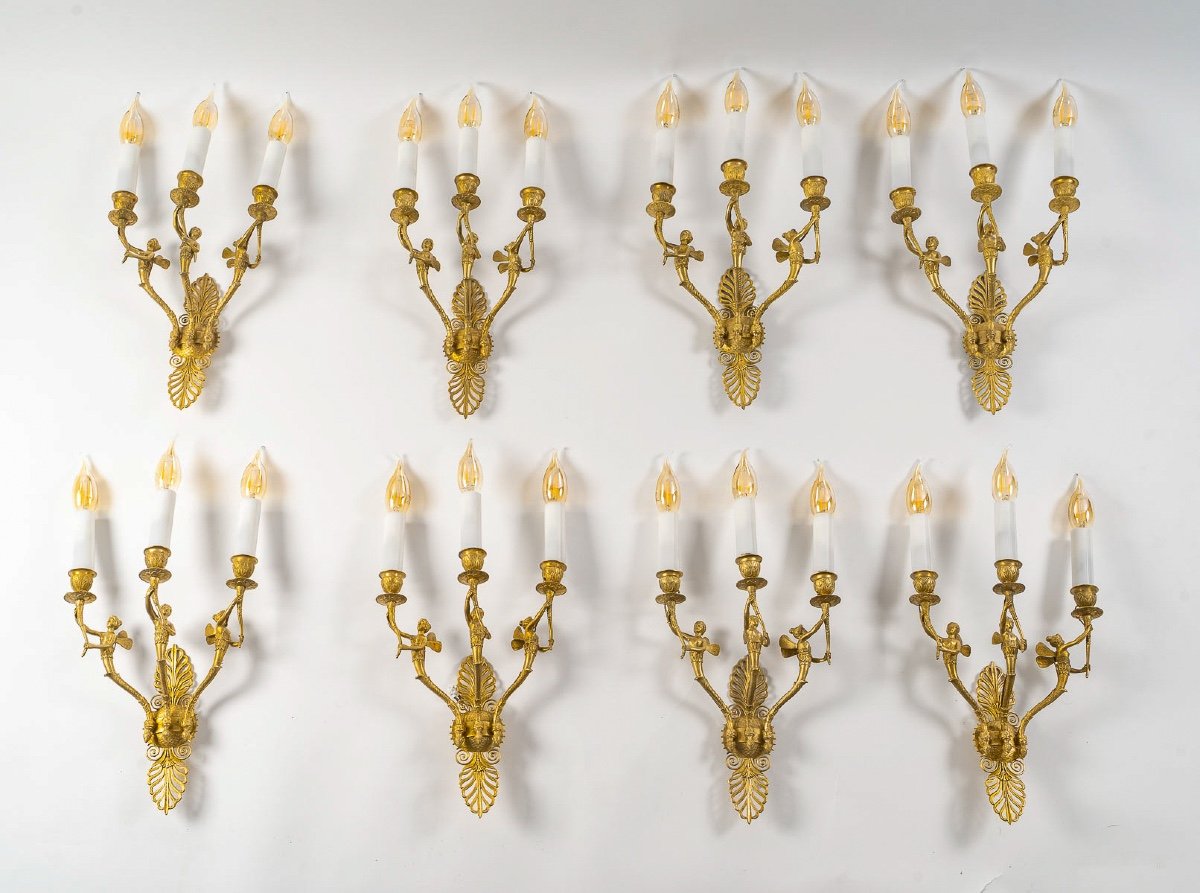 Set Of Eight French Empire-style Sconces In Chiseled Ormolu Decorated With Winged Women