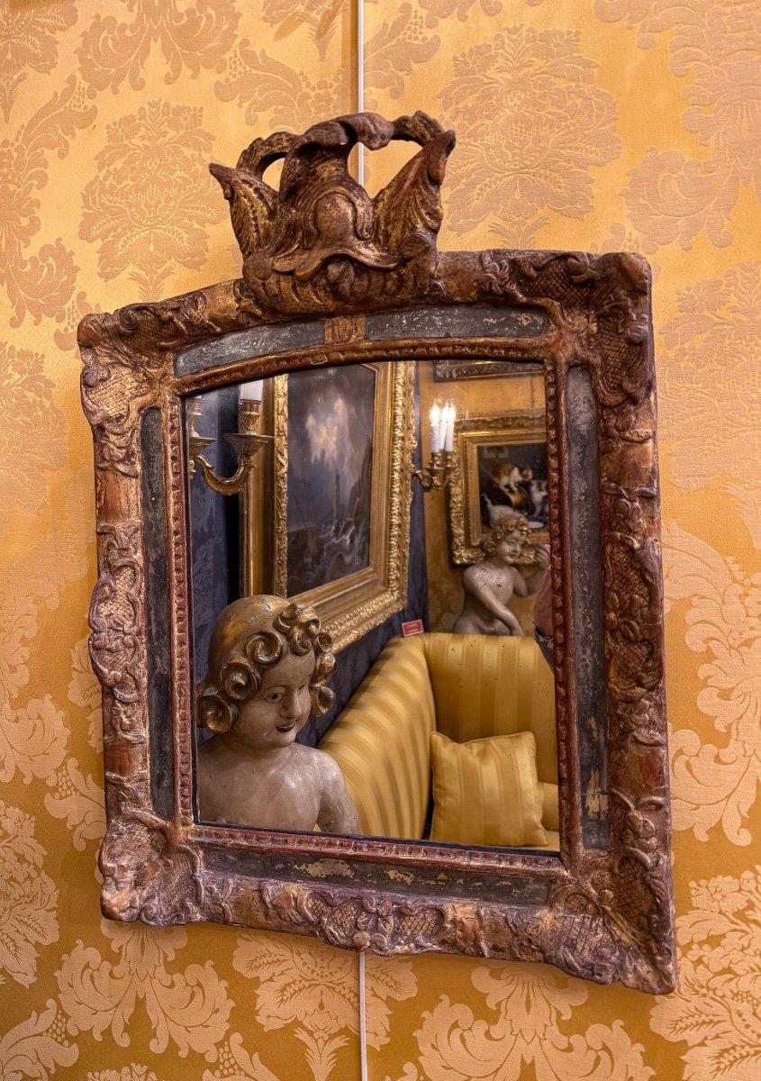 A Louis XIV Period Carved And Gilded Wood Martial Mirror With Parecloses Circa 1690-1710