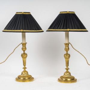 A Pair Of Louis XVI Period Finely Chiseled Gilt Bronze Candlesticks Mounted As Lamps