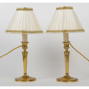 A Pair Of French Directoire Period Candlesticks Converted As Table-lamps In Gilt Bronze