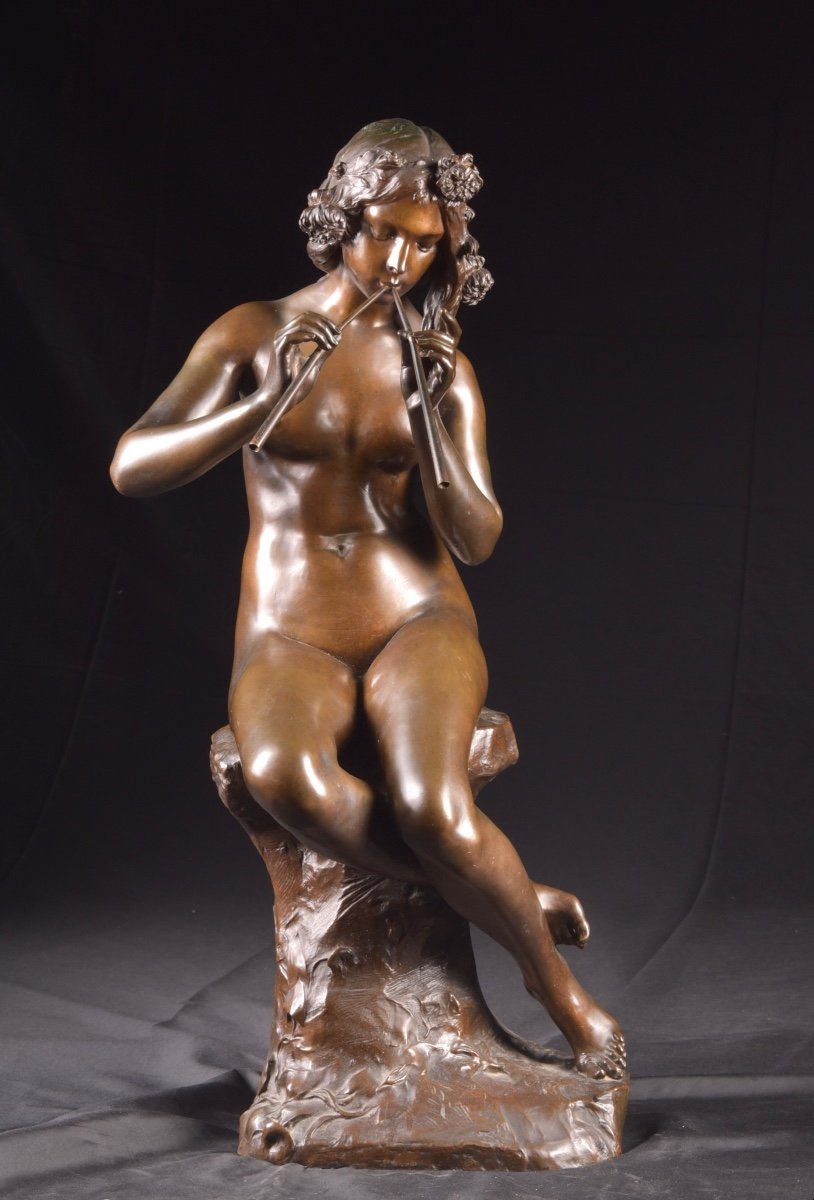 Jeune femme jouant de la flûte, par Auguste Carli (1868-1930)