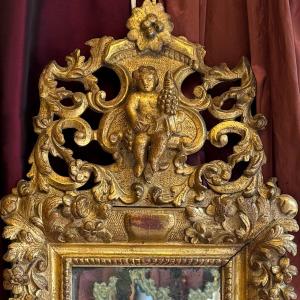 Bacchus enfant sur miroir,  époque Louis XIV, sculpté doré, XVIIIème. 