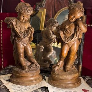 Big Pair Of Terracotta Children, Brown Patina, After Clodion. 19th Century.