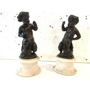 Pair Of Bronze Putti With Brown Patina On White Marble Base, 20th Century