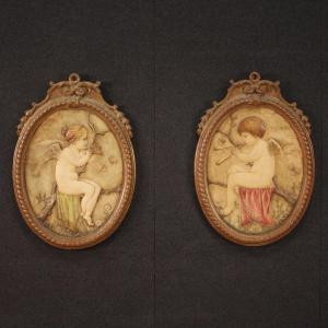 Pair Of Oval Terracotta Cherubs From The 20th Century