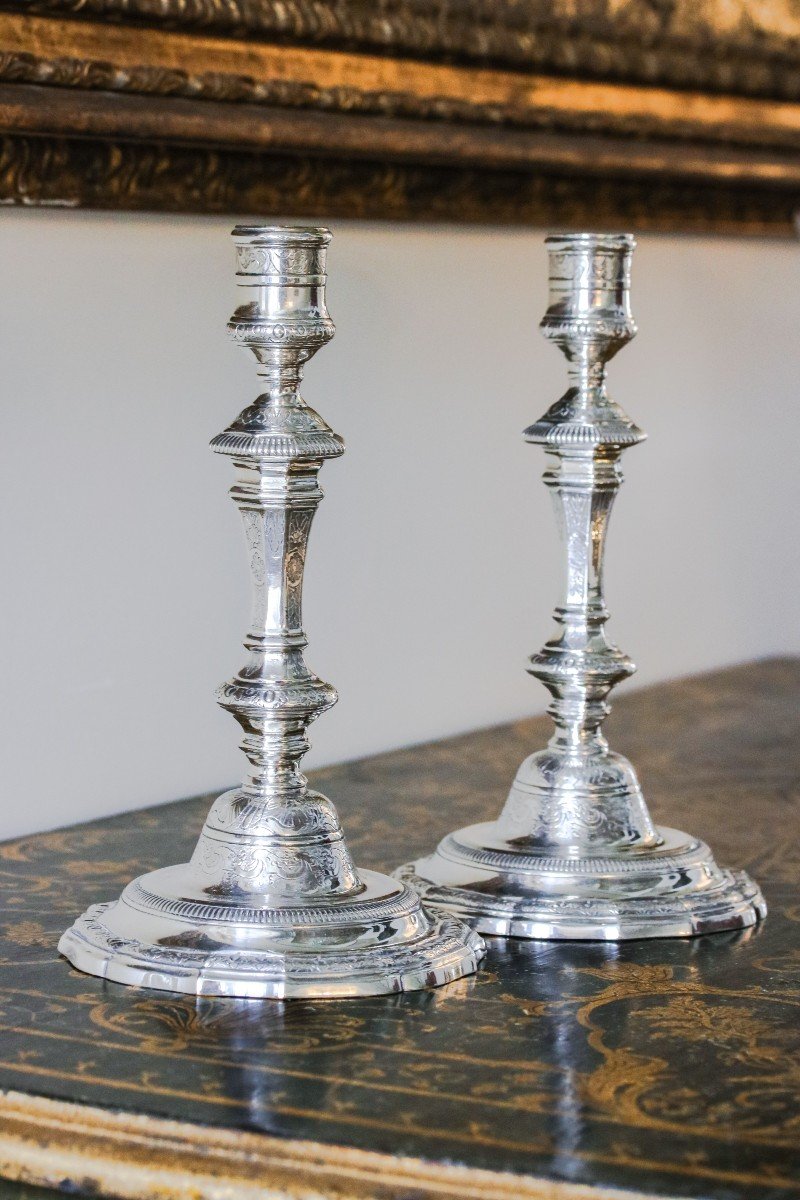 Pair Of Chiseled Silver Metal Candlesticks In The Shape Of A Baluster