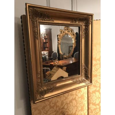 Petit miroir d’époque Empire bois doré 