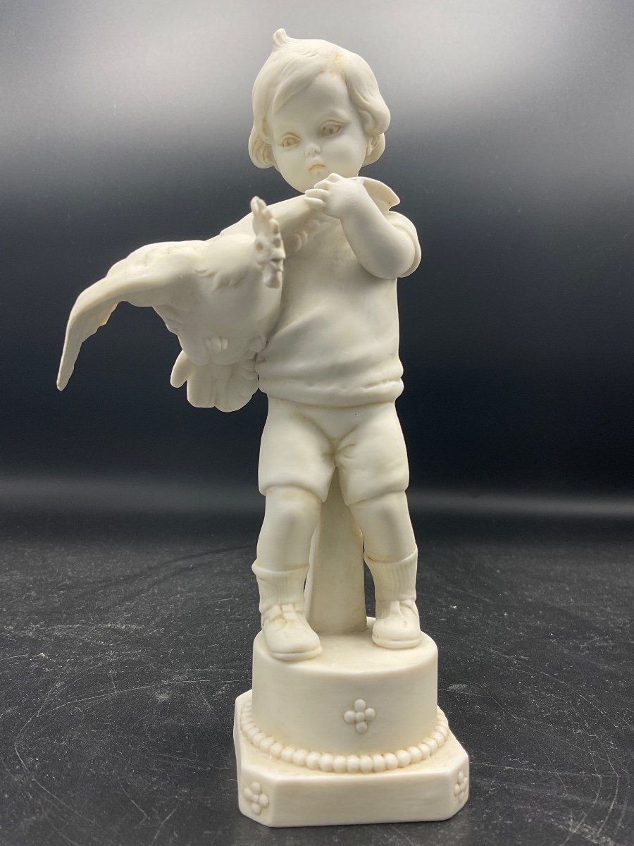 Biscuit From The Müller Factory Located In The Thuringia Region In Germany Representing A Boy With A Hen In His Arms.-photo-2