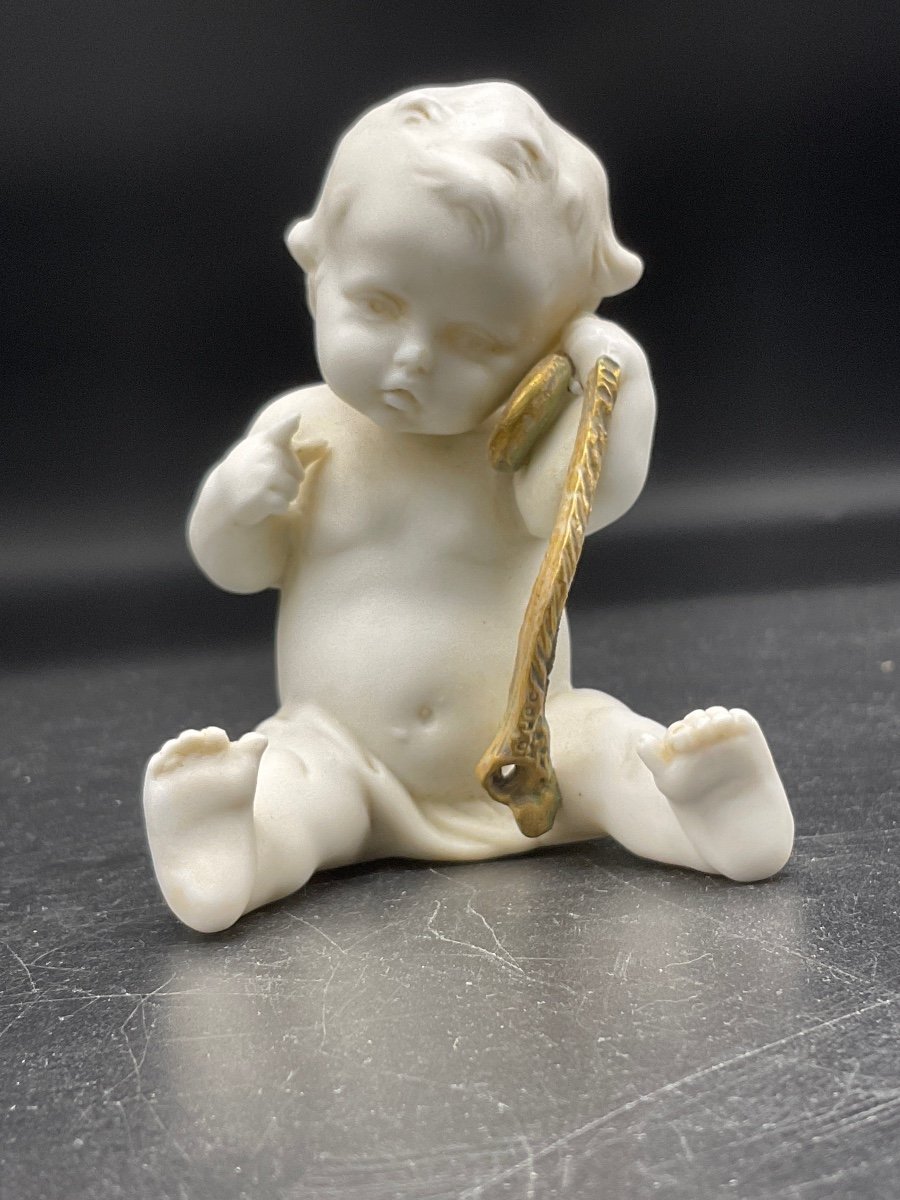 Biscuit From The Müller Manufacture Representing A Little Boy Sitting Listening To A Pocket Watch.