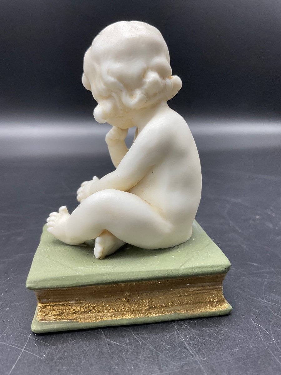 Biscuit From The Muller Factory Representing A Little Girl Sitting On A Book.-photo-6