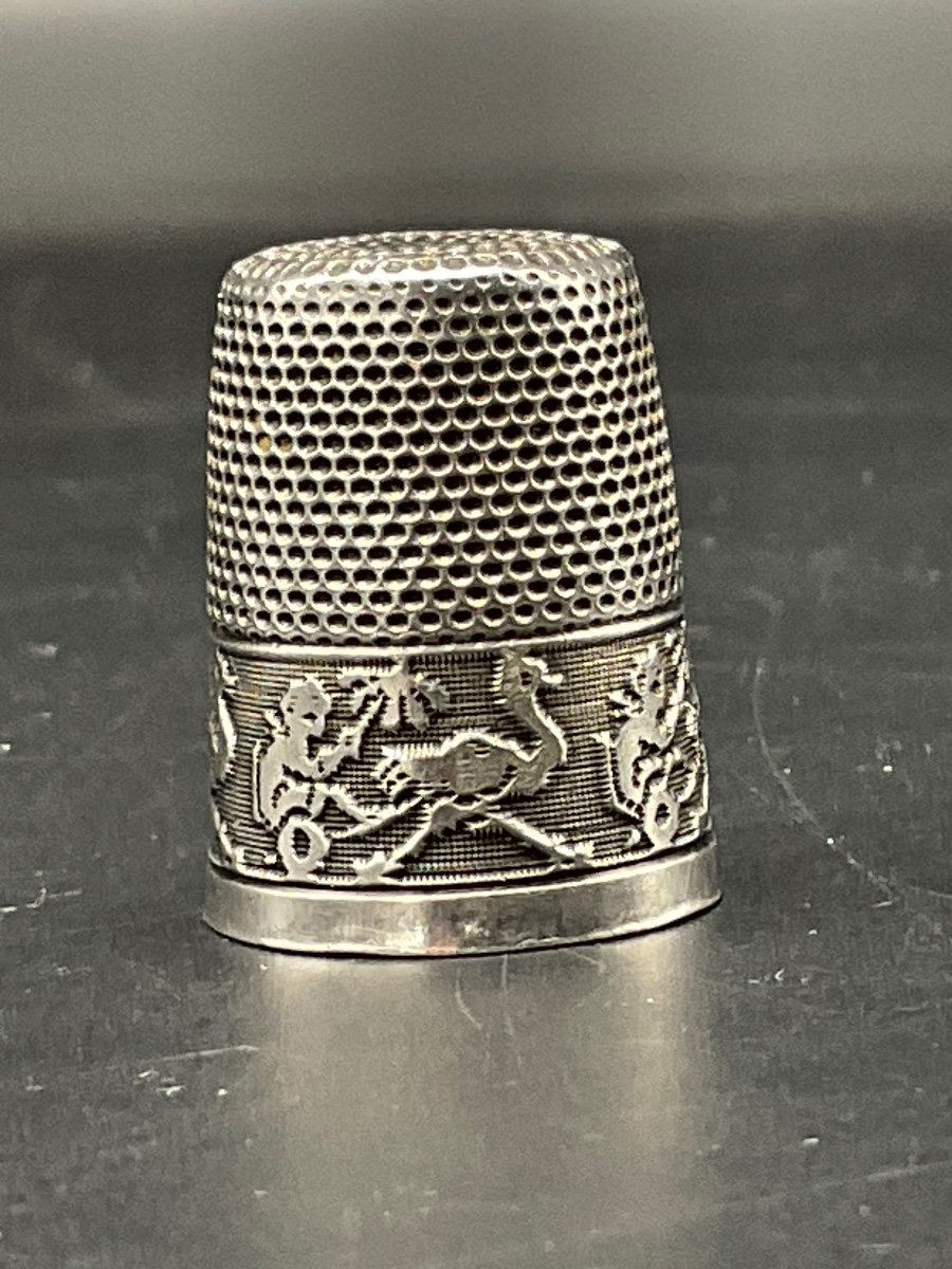 Sterling Silver Thimble Decorated With An Ostrich Pulling A Chariot With A Figure.