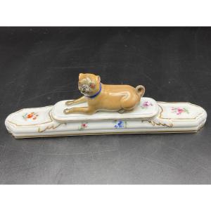 Polychrome Meissen Porcelain Paperweight With A Lying Pug Decorated With Flowers.