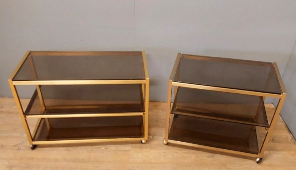 Italy 1970: 2 Trolley Tables On Wheels In Gold Metal And Tinted Glass