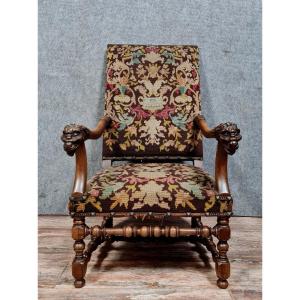 Renaissance Armchair In Carved Walnut Decorated With Lion Heads On The Armrests 