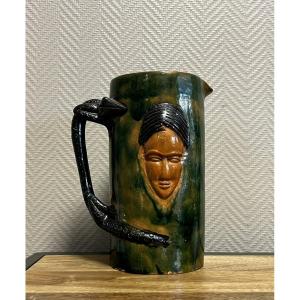 Large Enameled Terracotta Pitcher With An Asian Or Indian Face And A Salamander