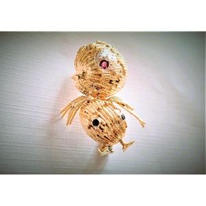 Broche motif oiseau saphirs et rubis en or 18 carats