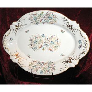 Grand plat de présentation en porcelaine de Limoges décor à l'oiseau époque 20ème