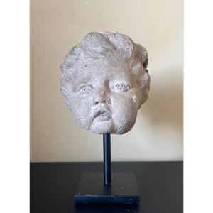 Carved Stone Putto Head 