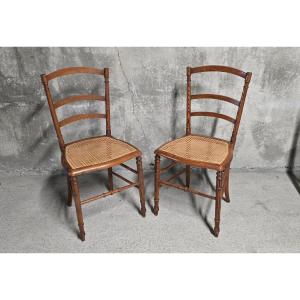 Pair Of Wooden And Cane Chairs