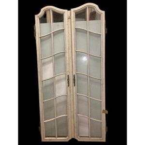 Pair Of Glass Doors With Scalloped Crossbar