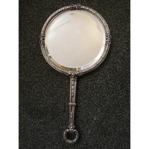 Petit miroir biseauté type face à main en argent massif Minerve de style Louis XVI