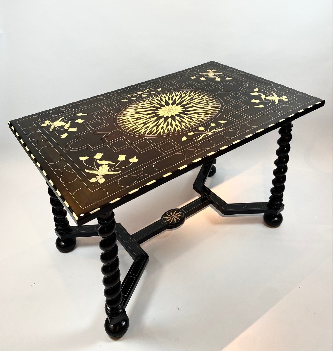 An 18th Century Central Table In Ebonized Wood And Inlaid With Bone.