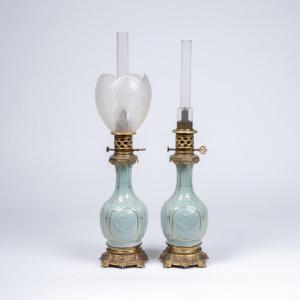 Paire de lampes à petrole en porcelaine céladon et bronze doré, XIXe