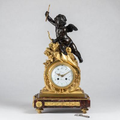 Guillaume Deni&egrave;re (1815-1901), pendule au Cupidon en bronze &agrave; patine brune et bronze dor&eacute;, XIXe